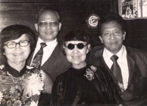 Christina Tsai, flanked by Ted Choy (left) and Moses Chow (right).